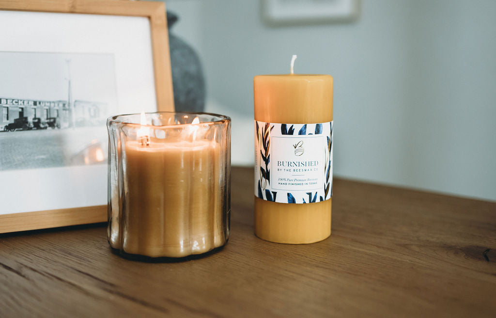 Burnished beeswax candles on a wooden table