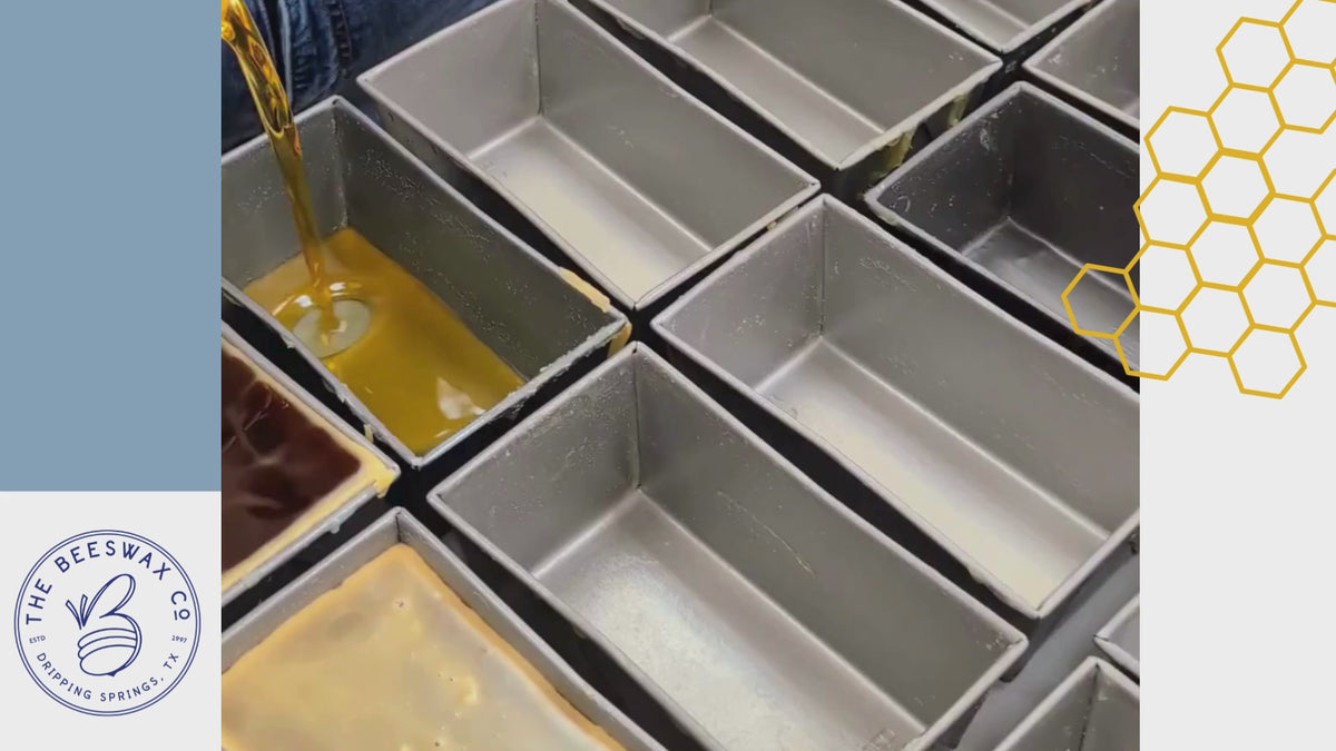 Pure Texas beeswax being hand-poured into block molds at The Beeswax Co. workshop